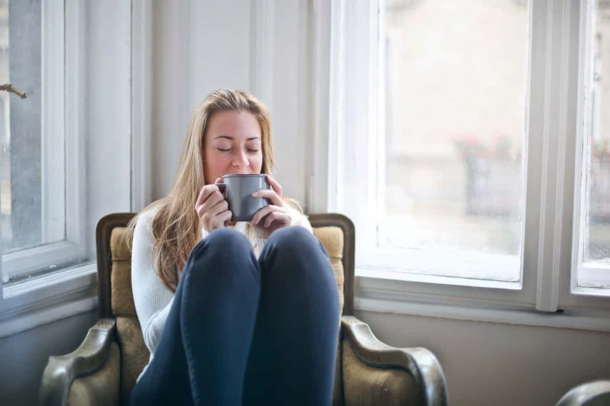 young woman girl sipping coffee Young woman enjoying sipping coffee