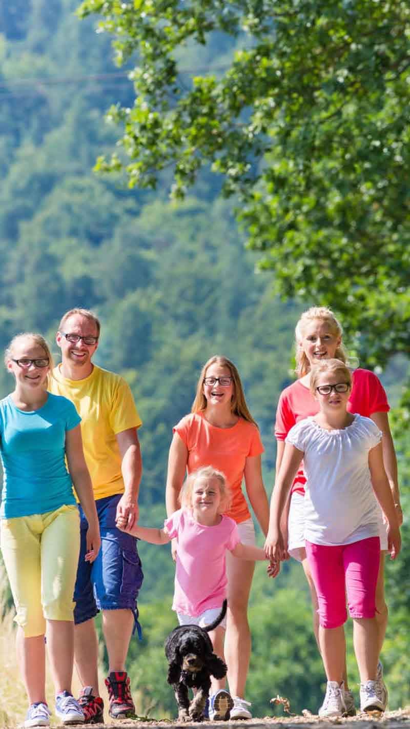 nature walk women family dog 800x1422 web small women walking in nature exercise